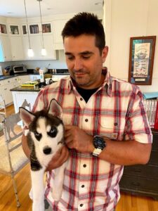 Me holding our pet husky, Aibo.