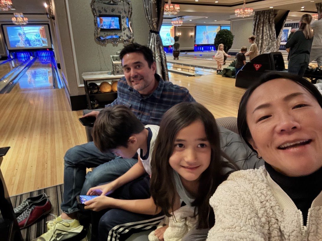 The family together at a bowling alley