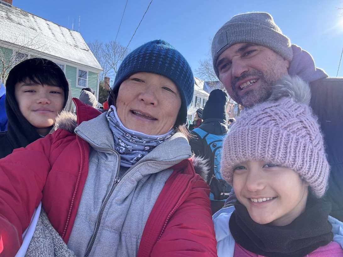 The family bundled up in winter hats for a selfie in town at the New Year's Day 5K